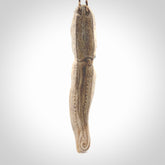 Hand carved octopus pendant. This piece has been carved in minute detail from deer antler. The artist is Fumio Noguchi, a renowned New Zealand bone carver who carves pieces for NZ Pacific. These unique bone pendants are for sale online at nzpacific.com One only collectors item for lovers of the ocean and octopus.